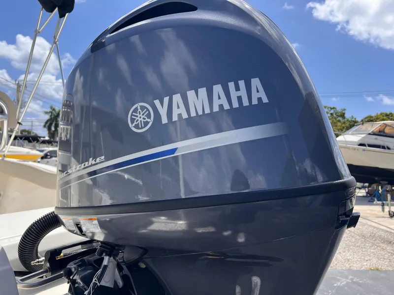 Slide: The Image of Yamaha outboard motor on 2025 Key West 179 FS boat under clear blue sky. - 15