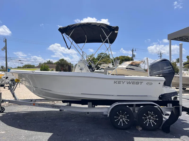 Slide: The Image of 2025 Key West 179 FS boat on trailer, featuring a sleek design and Yamaha outboard motor. - 3
