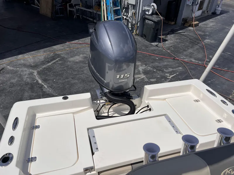 Slide: The Image of 2025 Key West 179 FS boat with Yamaha 115 outboard motor, docked at marina. - 8