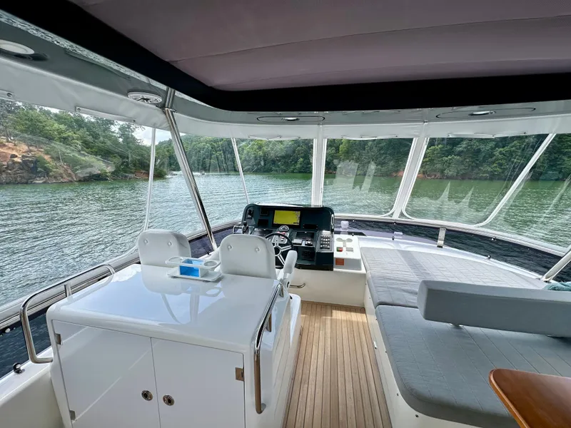 Slide: The Image of Interior view of 2021 Sirena 58 yacht with modern helm and seating area. - 34