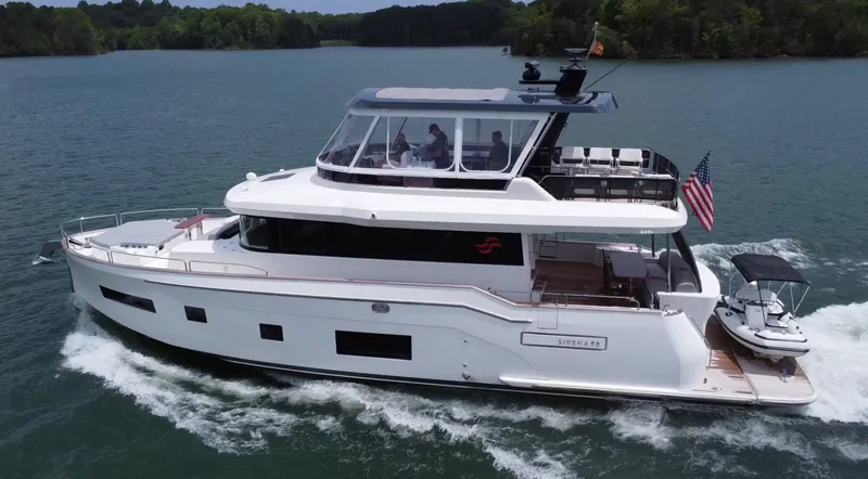 Slide: The Image of Luxury Sirena 58 yacht cruising on a serene lake, 2021 model. - 9