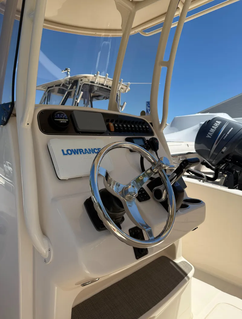 Slide: The Image of 2017 Grady-White Fisherman 209 boat console with steering wheel and Lowrance system. - 4