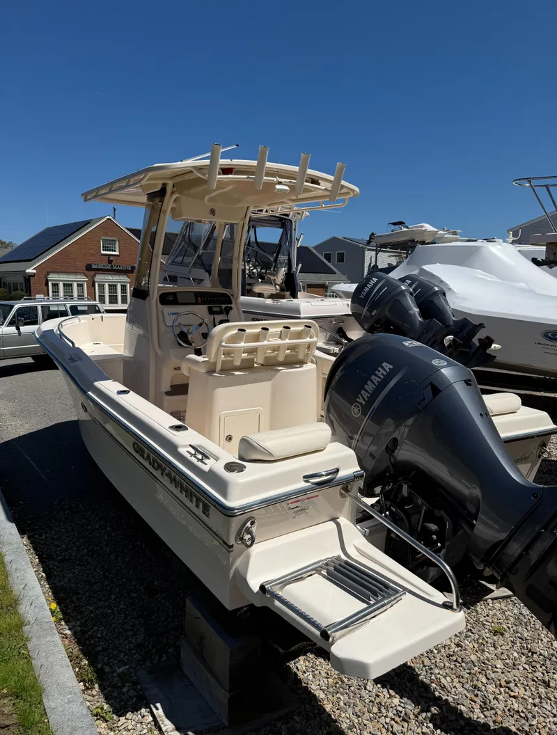 Slide: The Image of 2017 Grady-White Fisherman 209 boat with Yamaha outboard motor, docked outdoors. - 5