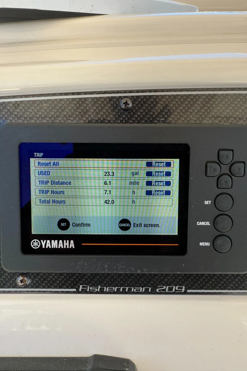 Slide: The Image of Yamaha display on 2017 Grady-White Fisherman 209 boat showing trip data and settings. - 9