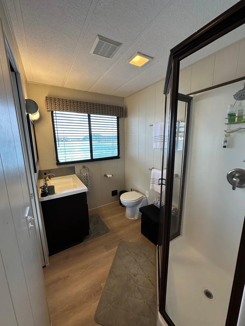 Slide: The Image of Bathroom in 1992 Sumerset 14x70 houseboat with shower, sink, and toilet. - 11