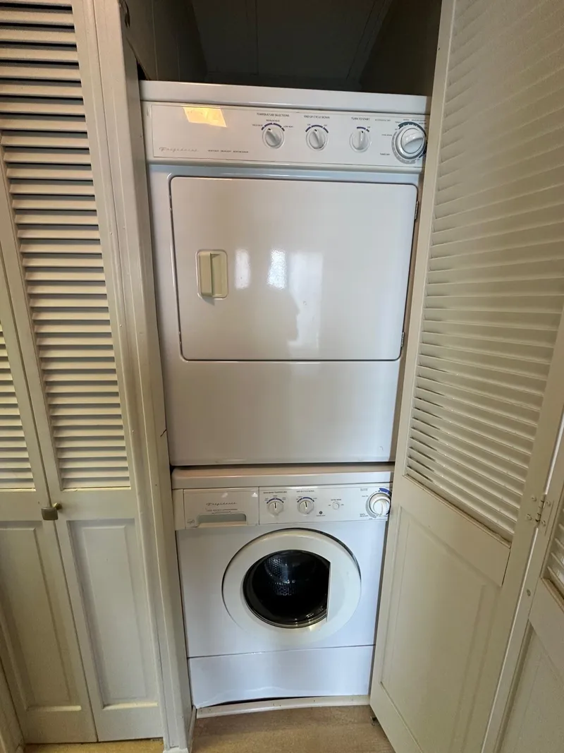 Slide: The Image of Stacked washer and dryer in a Sumerset 14x70, 1992 model. - 12