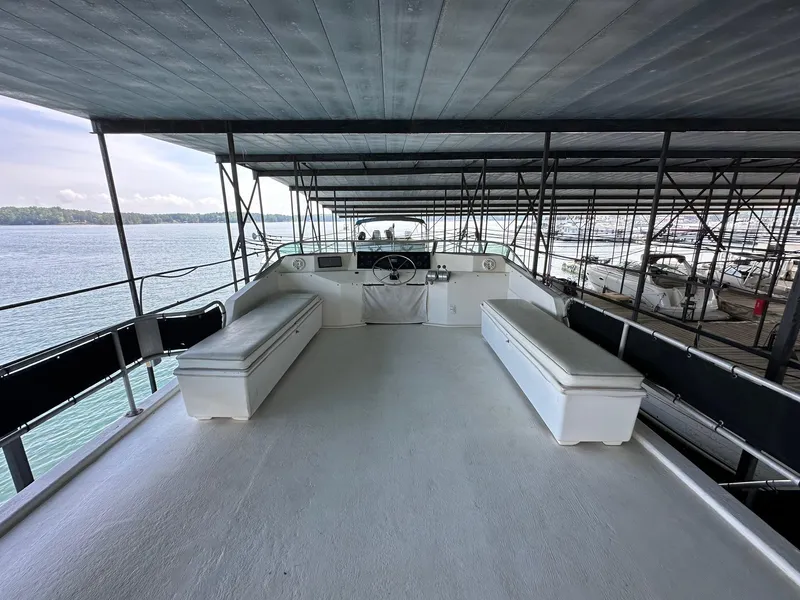 Slide: The Image of Upper deck of 1992 Sumerset 14x70 houseboat with seating, overlooking water. - 14