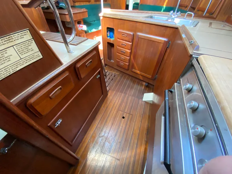Slide: The Image of Interior of 1989 Hunter Legend 40 sailboat with wooden cabinetry and kitchen area. - 28
