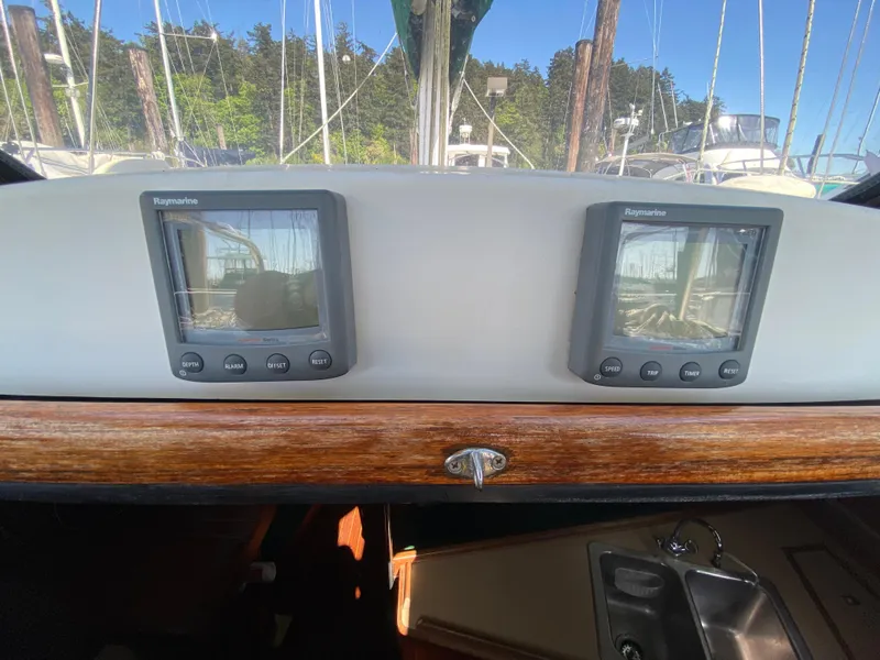 Slide: The Image of Control panel of 1989 Hunter Legend 40 sailboat with dual Raymarine displays. - 43
