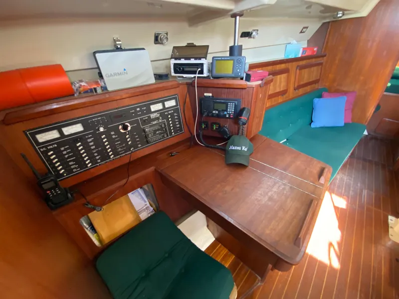 Slide: The Image of 1989 Hunter Legend 40 yacht interior with navigation equipment and wooden furnishings. - 8