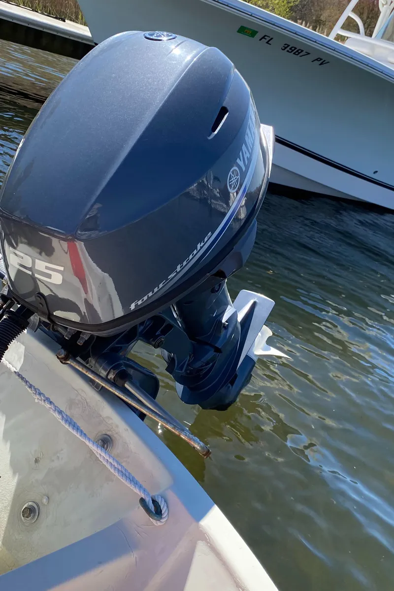 Slide: The Image of 1974 Boston Whaler 13 with Yamaha outboard motor on water. - 3