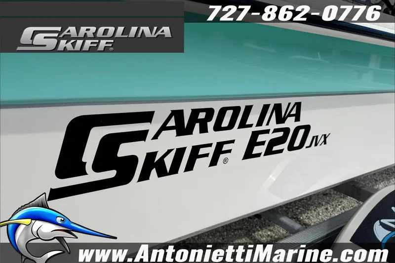 Slide: The Image of 2025 Carolina Skiff E20 JVX boat with logo and contact details. - 13