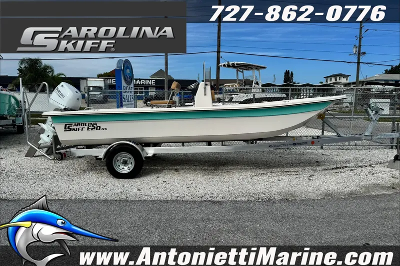 Slide: The Image of 2025 Carolina Skiff E20 JVX boat on trailer at Antonietti Marine dealership. - 2