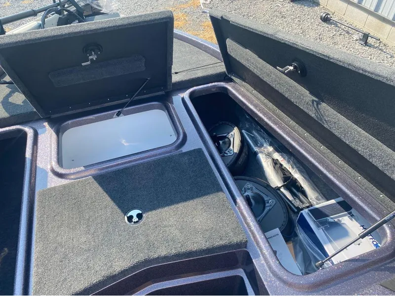 Slide: The Image of 2025 Skeeter ZX150 boat storage compartments with equipment and accessories. - 11