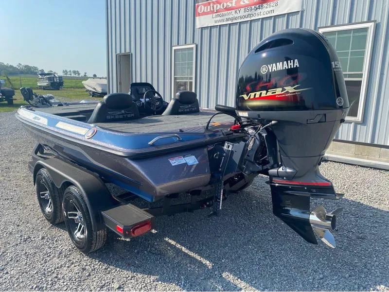 Slide: The Image of 2025 Skeeter ZX150 boat with Yamaha VMAX engine, parked outside a building. - 14