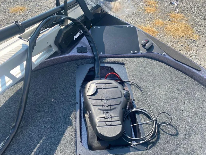 Slide: The Image of 2025 Skeeter ZX150 boat deck with Minn Kota trolling motor and control panel. - 16