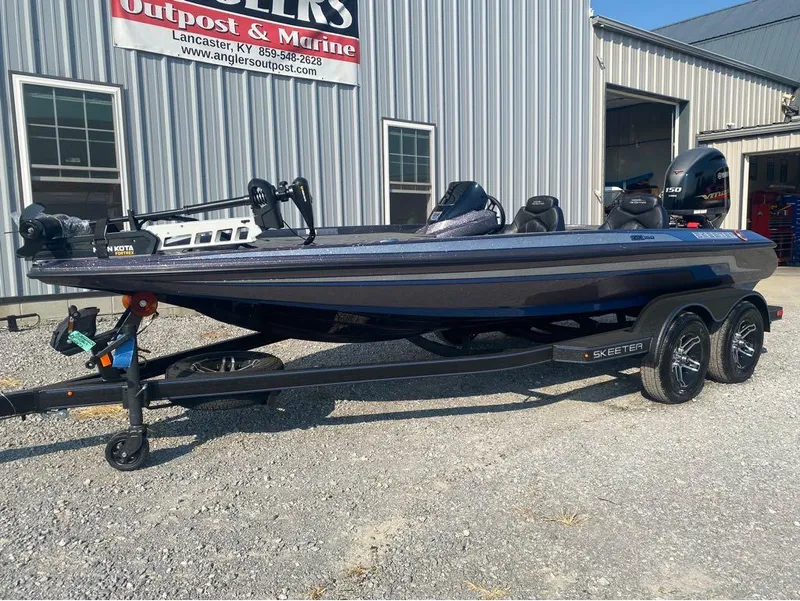 Slide: The Image of 2025 Skeeter ZX150 boat on trailer outside Anglers Outpost & Marine. - 9