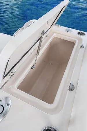 Slide: The Image of 2025 Grady-White Freedom 235 boat storage compartment open on deck. - 13
