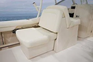 Slide: The Image of 2025 Grady-White Freedom 235 boat interior with cream seating and ocean view. - 16