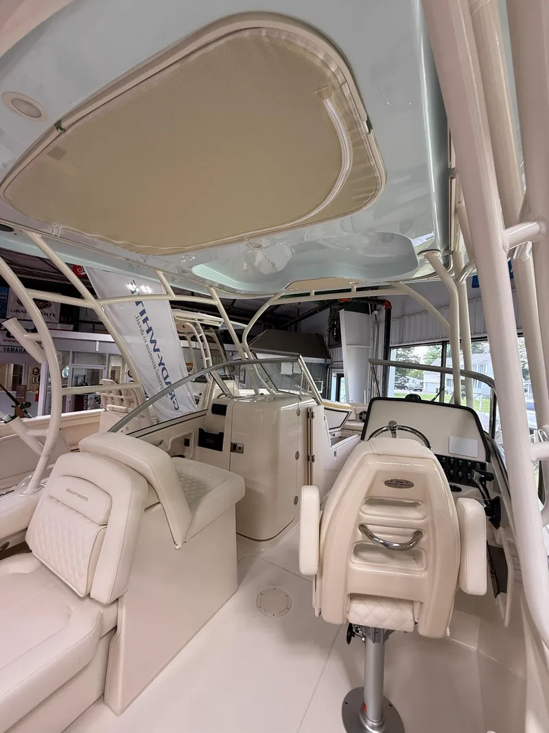 Slide: The Image of 2025 Grady-White Freedom 235 boat interior with seating and helm station. - 5