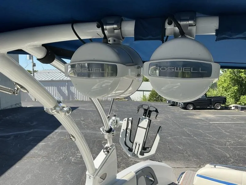 Slide: The Image of Roswell speakers on 2021 Cobalt R7 Surf boat, under blue canopy. - 11