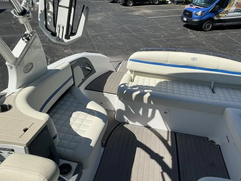 Slide: The Image of 2021 Cobalt R7 Surf boat interior with white seating and modern design. - 13