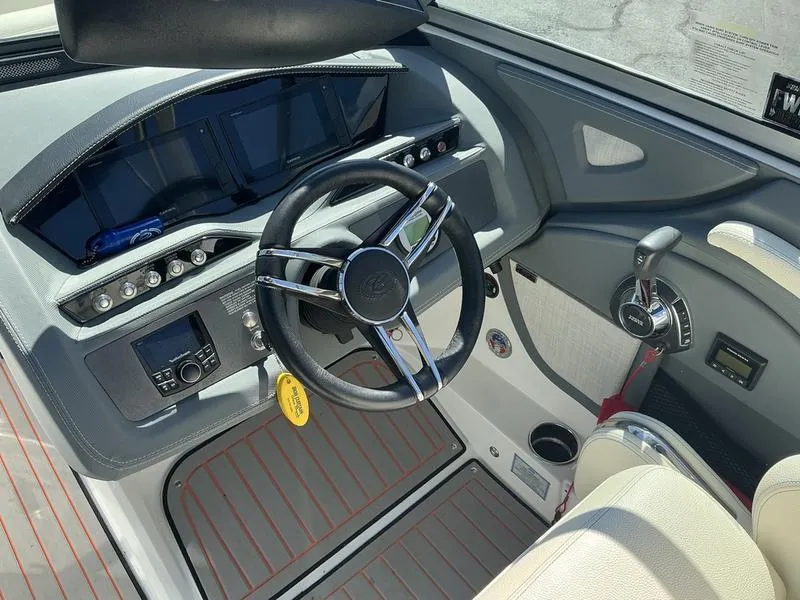 Slide: The Image of 2021 Cobalt R7 Surf boat cockpit with steering wheel and control panel. - 4