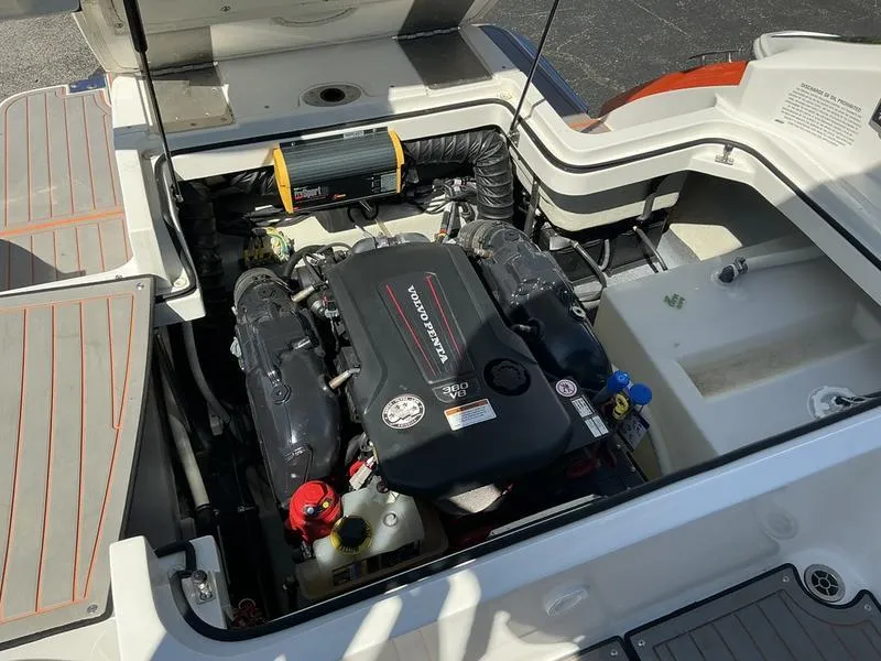 Slide: The Image of Engine compartment of a 2021 Cobalt R7 Surf boat, featuring a Volvo Penta engine. - 9