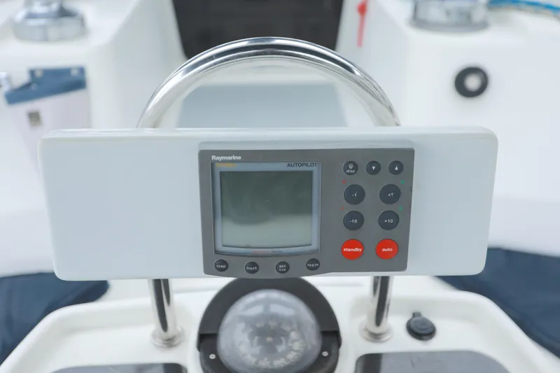 Slide: The Image of Control panel of a 1995 Hunter 430 sailboat with navigation instruments. - 14