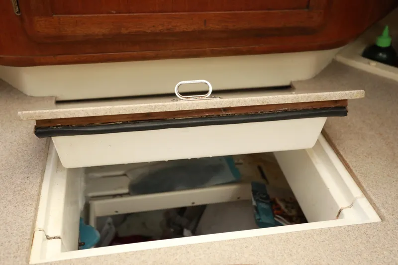Slide: The Image of Open storage compartment in a 1995 Hunter 430 boat interior. - 25