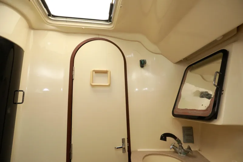 Slide: The Image of Interior of a 1995 Hunter 430 sailboat bathroom with skylight and mirror. - 36