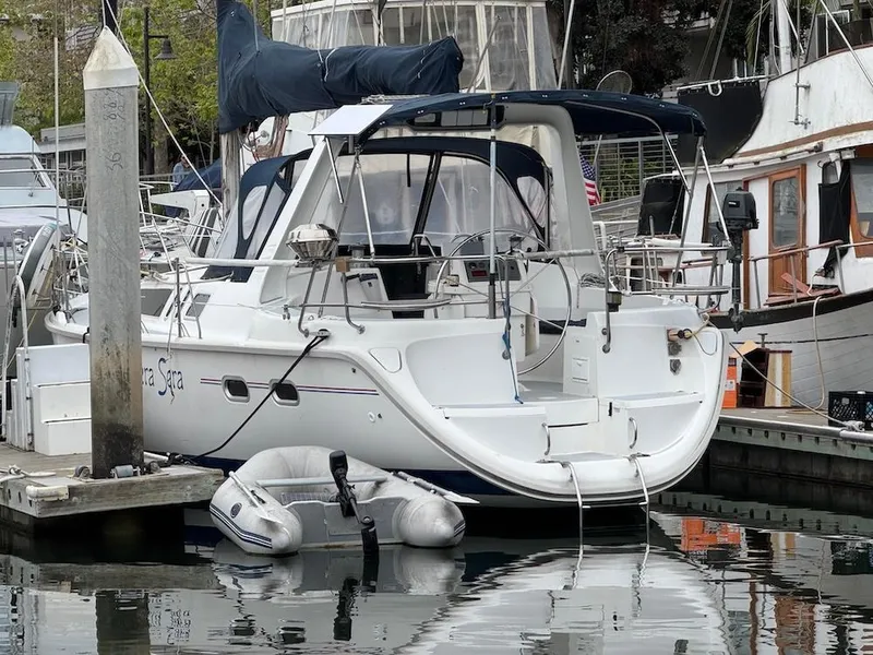 Slide: The Image of Hunter 430 sailboat from 1995 docked with inflatable dinghy. - 5