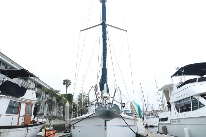 Slide: The Image of Sailboat docked at marina, Hunter 430 model, 1995, surrounded by other boats. - 6