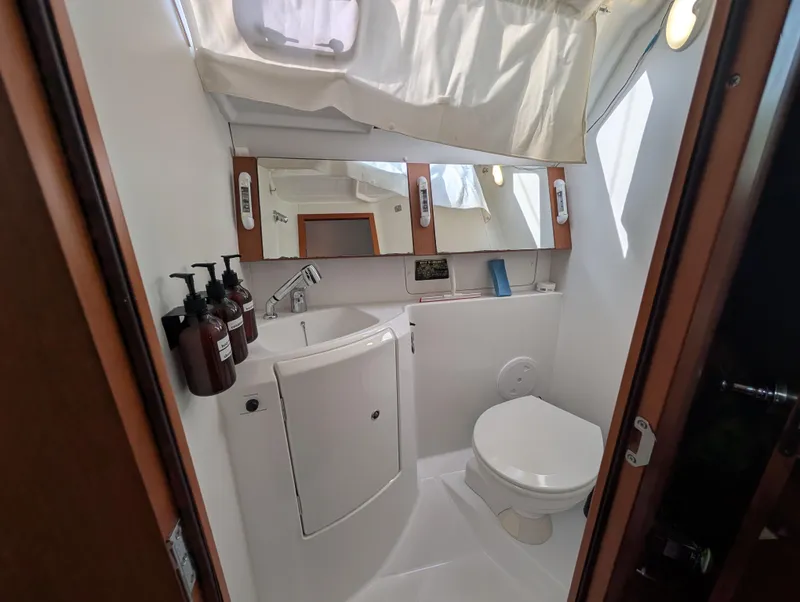 Slide: The Image of Bathroom interior of 2015 Beneteau Oceanis 37 Platinum yacht, featuring sink and toilet. - 17