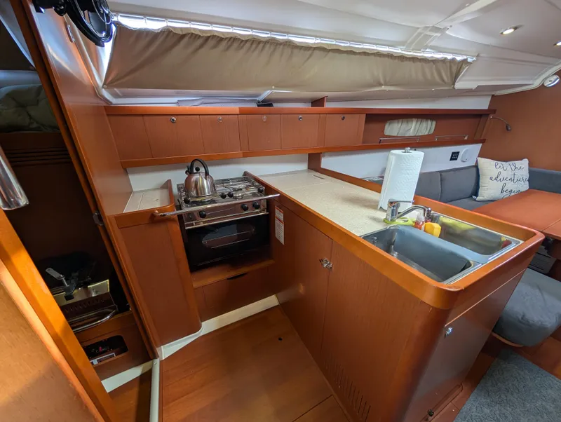 Slide: The Image of Interior of 2015 Beneteau Oceanis 37 Platinum yacht kitchen with stove and sink. - 20