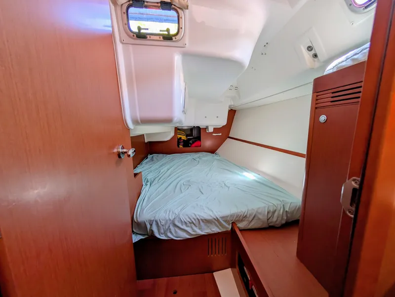 Slide: The Image of Cozy cabin interior of 2015 Beneteau Oceanis 37 Platinum sailboat with wooden finishes. - 23