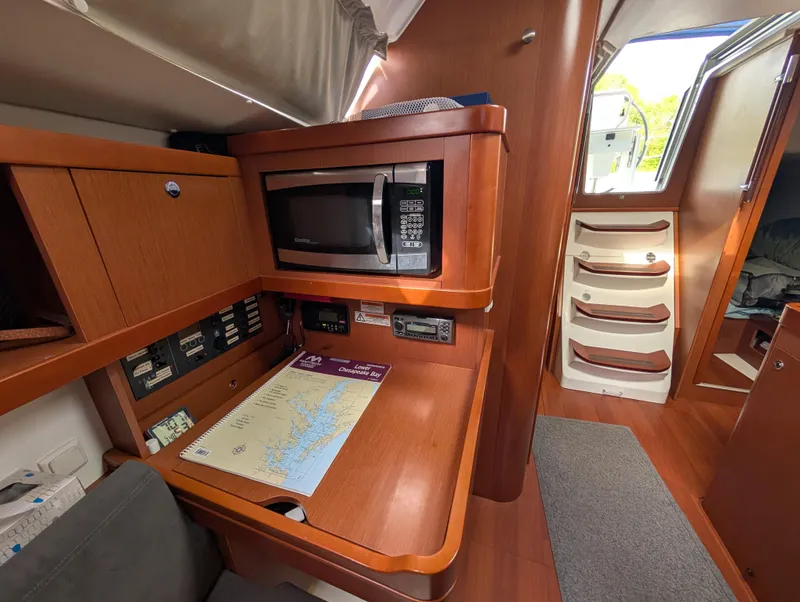 Slide: The Image of Interior of 2015 Beneteau Oceanis 37 Platinum yacht with microwave and navigation area. - 25