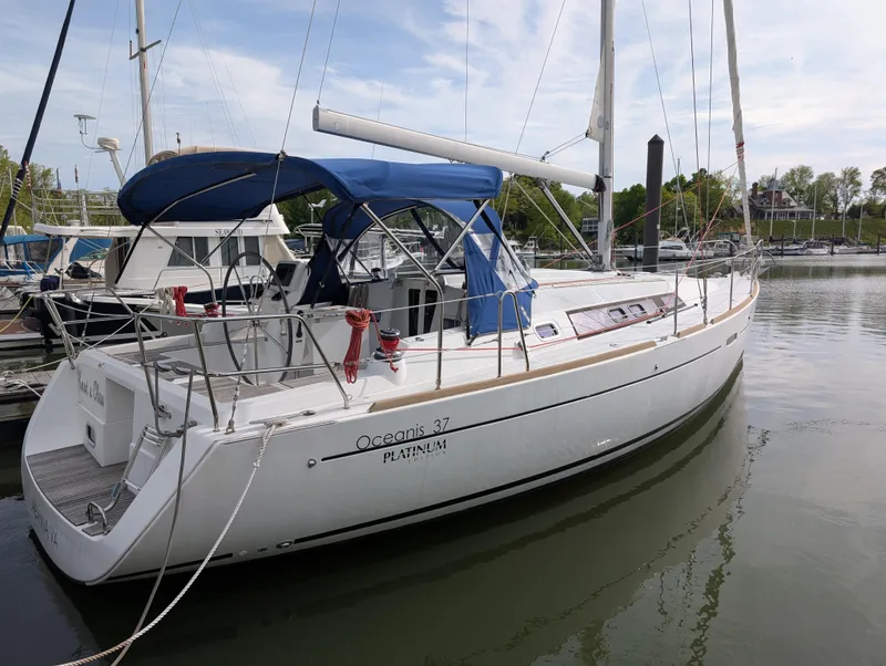 Slide: The Image of 2015 Beneteau Oceanis 37 Platinum sailboat docked in marina. - 4