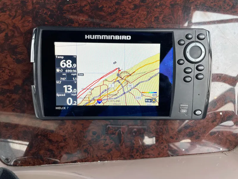 Slide: The Image of Humminbird Helix 7 GPS on 2003 Regal 3860 Commodore boat dashboard. - 14