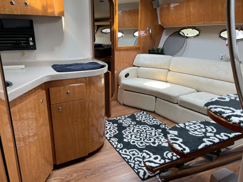 Slide: The Image of Luxurious interior of 2003 Regal 3860 Commodore yacht with modern kitchen and cozy seating area. - 15