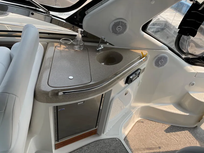 Slide: The Image of 2003 Regal 3860 Commodore yacht interior with sink and mini fridge. - 18