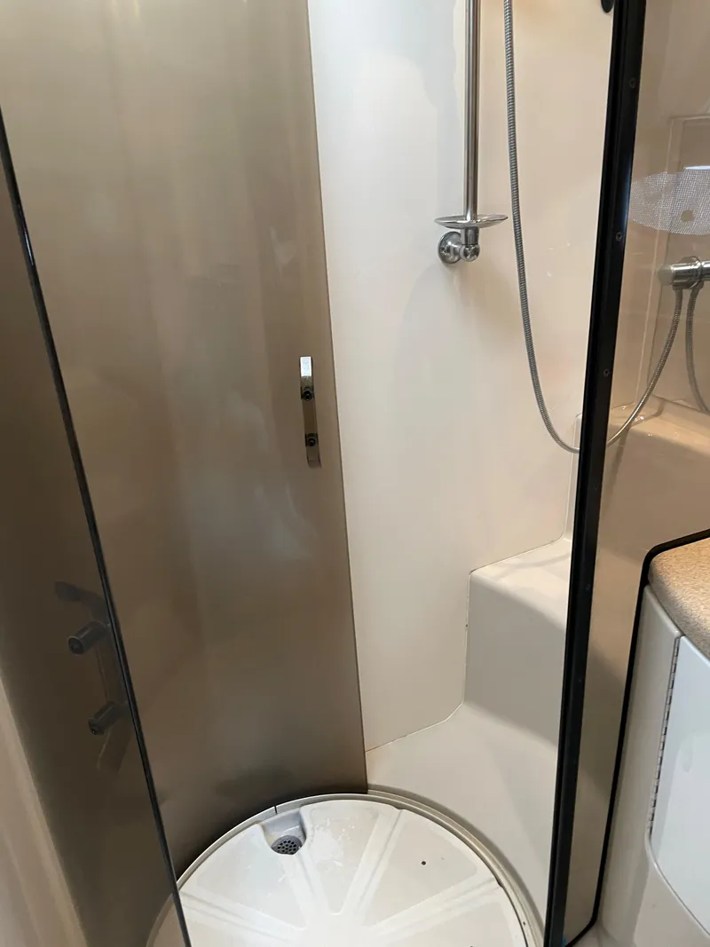 Slide: The Image of Shower area in 2003 Regal 3860 Commodore yacht, featuring modern fixtures and compact design. - 19