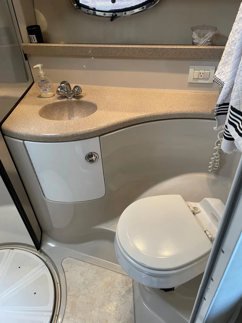 Slide: The Image of 2003 Regal 3860 Commodore yacht bathroom with sink, toilet, and shower. - 20