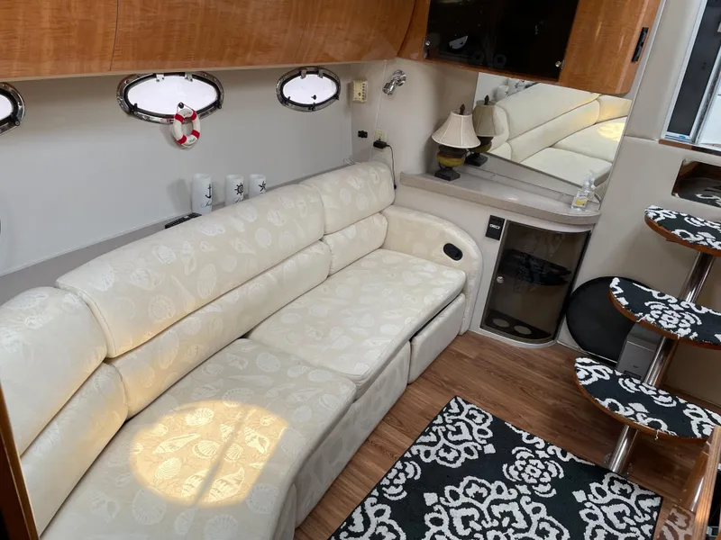 Slide: The Image of Luxurious interior of 2003 Regal 3860 Commodore yacht with elegant seating and decor. - 6