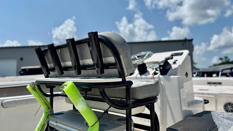 Slide: The Image of 2025 Carolina Skiff 19 LS Stealth Edition boat interior with seating and steering console. - 7