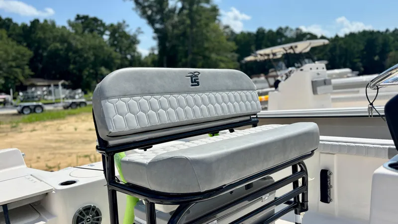 Slide: The Image of 2025 Carolina Skiff 19 LS Stealth Edition boat interior with stylish seating and sleek design. - 8