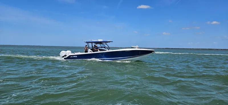 Slide: The Image of Interior of 2026 Nor-Tech 390 Sport Center Console, featuring sleek design and modern amenities. - 24