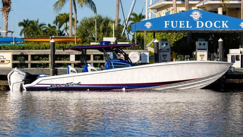 Slide: The Image of 2026 Nor-Tech 390 Sport Center Console dashboard with steering wheel and controls. - 3