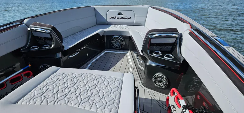 Slide: The Image of 2026 Nor-Tech 390 Sport Center Console boat on trailer with powerful outboard engines. - 5