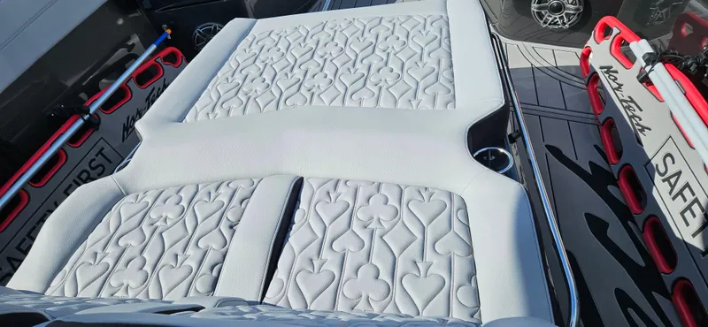 Slide: The Image of 2026 Nor-Tech 390 Sport Center Console boat, sleek design, spacious seating, outdoor setting. - 6